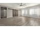 Living room with hardwood floors and barn doors at 23559 W Wayland Dr, Buckeye, AZ 85326