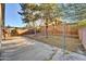 Backyard with concrete patio, grass area, and mature trees at 4723 N 84Th Ln, Phoenix, AZ 85037