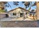 Backyard view of home with patio and surrounding trees at 4723 N 84Th Ln, Phoenix, AZ 85037