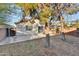 Backyard view of home with patio and surrounding trees at 4723 N 84Th Ln, Phoenix, AZ 85037