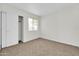 Bright bedroom with carpet flooring and spacious closet at 4723 N 84Th Ln, Phoenix, AZ 85037