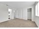 Bright bedroom featuring neutral walls and carpet, plus a large closet at 4723 N 84Th Ln, Phoenix, AZ 85037