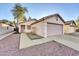 Front view of a house with a garage and walkway at 4723 N 84Th Ln, Phoenix, AZ 85037