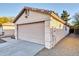 View of the attached garage and exterior wall at 4723 N 84Th Ln, Phoenix, AZ 85037