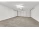 Spacious garage with overhead door and ample storage at 4723 N 84Th Ln, Phoenix, AZ 85037