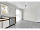 Kitchen with stainless steel dishwasher and tile floor at 4723 N 84Th Ln, Phoenix, AZ 85037