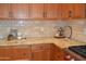 Kitchen corner with granite countertops and wood cabinets at 13204 W Palo Verde Dr, Litchfield Park, AZ 85340