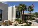 Clubhouse exterior featuring a desert landscape with native palm trees, cacti, and an American flag at 25609 N Forest Rd # 13, Rio Verde, AZ 85263