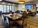 Spacious dining room featuring ample seating, fireplace, and wall mounted TV at 25609 N Forest Rd # 13, Rio Verde, AZ 85263