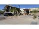 Well maintained building with lush landscaping and a variety of drought-tolerant plants, along with a car at 25609 N Forest Rd # 13, Rio Verde, AZ 85263