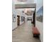 Bright hallway with tiled floors, contemporary light fixtures, and seating at 25609 N Forest Rd # 13, Rio Verde, AZ 85263