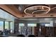 Bright library with extensive bookshelves and contemporary lighting fixtures enhancing the reading experience at 25609 N Forest Rd # 13, Rio Verde, AZ 85263