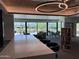 Library featuring a countertop bar, bookshelves, and views of the golf course at 25609 N Forest Rd # 13, Rio Verde, AZ 85263