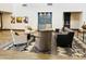 Comfortable lobby area with armchairs, sofa, wood floors, patterned rug and decorative art at 25609 N Forest Rd # 13, Rio Verde, AZ 85263