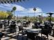 Outdoor patio dining area with tables, chairs, and view of the property at 25609 N Forest Rd # 13, Rio Verde, AZ 85263