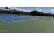 Outdoor tennis courts featuring mountain views and a secure fenced perimeter at 25609 N Forest Rd # 13, Rio Verde, AZ 85263