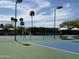 Sunny tennis courts with shaded seating areas offering a lovely venue for recreational enjoyment at 25609 N Forest Rd # 13, Rio Verde, AZ 85263