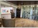 Wine storage area with a glass enclosed cabinet and wall of wine bottles at 25609 N Forest Rd # 13, Rio Verde, AZ 85263