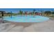 Community splash pad with playground in view at 30080 W Fairmount Ave, Buckeye, AZ 85396