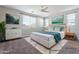 Bright main bedroom featuring stylish decor, an area rug, and lots of natural light at 8828 S 167Th Ln, Goodyear, AZ 85338