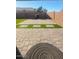 A back patio paved with decorative pavers and featuring grass squares at 9433 W Cinnabar Ave, Peoria, AZ 85345