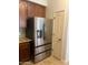 Updated kitchen features a stainless steel refrigerator with a water and ice dispenser at 11000 N 77Th Pl # 1083, Scottsdale, AZ 85260