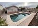 A private backyard pool with built-in barbecue provides a great outdoor space for relaxation and entertainment at 12742 W Ash St, El Mirage, AZ 85335