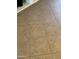 Close up of square brown floor tiles in a home, providing a durable and stylish foundation for any room at 12742 W Ash St, El Mirage, AZ 85335