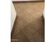 Close up of diagonally laid brown floor tiles, perfect for adding warmth and texture to any space in the home at 12742 W Ash St, El Mirage, AZ 85335
