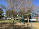 View of the park's swing set playground, offering a fun and safe recreational space for children at 12742 W Ash St, El Mirage, AZ 85335