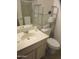 Bathroom with a light marble sink, and chrome shelf with towels and toiletries at 1881 E Kerby Farms Rd, Chandler, AZ 85249