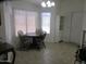 Charming dining area with a round table, three chairs, and bright natural light at 1881 E Kerby Farms Rd, Chandler, AZ 85249