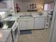 Kitchen with white countertops, cabinets, and a view into living area at 1881 E Kerby Farms Rd, Chandler, AZ 85249