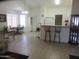 Bright and airy living area with tile floors, breakfast bar, and dining area at 1881 E Kerby Farms Rd, Chandler, AZ 85249
