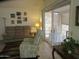 Living area featuring a sofa, recliner, and access to screened in patio at 1881 E Kerby Farms Rd, Chandler, AZ 85249
