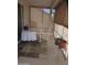 A screened-in patio offers a tranquil space with a rocking chair and a table at 1881 E Kerby Farms Rd, Chandler, AZ 85249