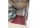 This storage area has a water heater, some metal shelving units, and red carpeting at 1881 E Kerby Farms Rd, Chandler, AZ 85249