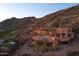 Expansive desert home with a private pool sits at the base of a picturesque mountain range at 6020 E Indian Bend Rd, Paradise Valley, AZ 85253