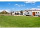 Expansive front lawn and a circular driveway leading up to this spectacular white stucco house at 6541 N 48Th St, Paradise Valley, AZ 85253