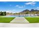 Luxurious pool with stepping stone pavers and a perfectly manicured lawn at 6541 N 48Th St, Paradise Valley, AZ 85253