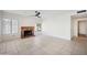 Living room features a brick fireplace and tile floors at 18012 N 55Th St, Scottsdale, AZ 85254