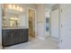 Bathroom with vanity, access to bedroom and closet at 18949 W Ocotillo Rd, Waddell, AZ 85355