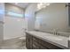 Bathroom boasts double vanity, granite countertop, and bathtub at 18949 W Ocotillo Rd, Waddell, AZ 85355