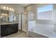 Bathroom features a shower and soaking tub at 18949 W Ocotillo Rd, Waddell, AZ 85355