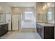 Elegant bathroom with soaking tub and shower at 18949 W Ocotillo Rd, Waddell, AZ 85355