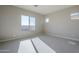 Spacious bedroom with large windows and carpet at 18949 W Ocotillo Rd, Waddell, AZ 85355