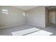 Bright bedroom with carpet and neutral walls at 18949 W Ocotillo Rd, Waddell, AZ 85355