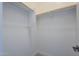 Bright walk-in closet with shelving and rods at 18949 W Ocotillo Rd, Waddell, AZ 85355