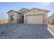 New construction home with stone accents and a two-car garage at 18949 W Ocotillo Rd, Waddell, AZ 85355