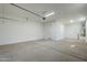 Spacious garage with door leading to backyard at 18949 W Ocotillo Rd, Waddell, AZ 85355